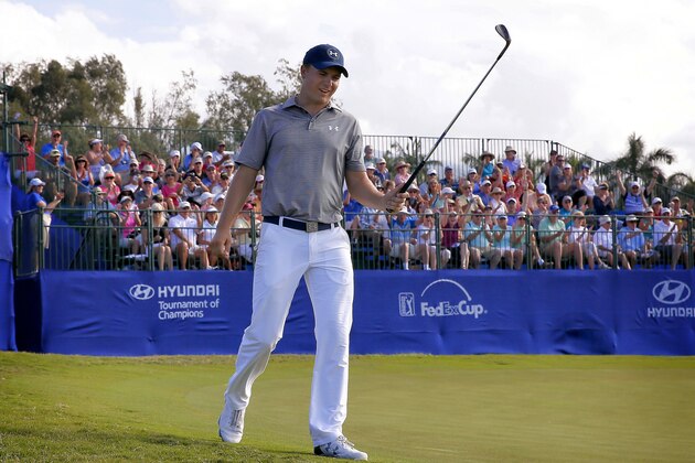 Jordan Spieth reacts to sinking a shot for eagle on the ninth green during the second round of the Tournament of Champions golf event Friday, Jan. 8, 2016, at Kapalua Plantation Course in Kapalua, Hawaii. (AP Photo/Matt York)