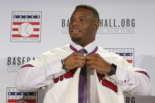 Ken Griffey Jr. buttons up his Hall of Fame jersey after he and Mike Piazza were  announced as electees into the 2016  Baseball Hall of Fame class, Thursday, Jan. 7, 2016, in New York.  (AP Photo/Kathy Willens)
