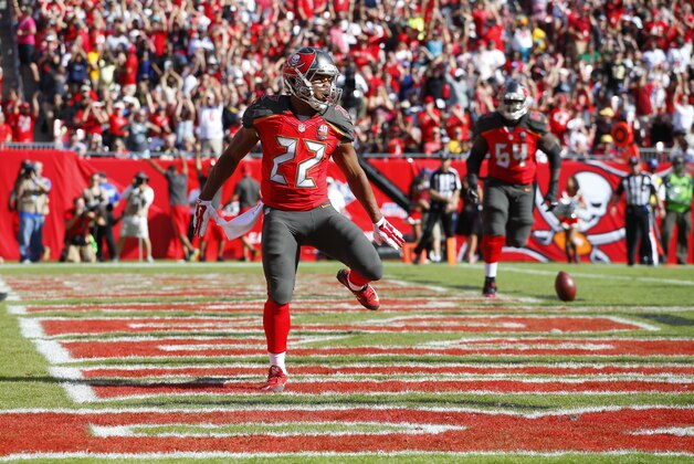 Tampa Bay Buccaneers running back Doug Martin (22) celebrates after a touchdown against the New Orleans Saints during an NFL football game Sunday, Dec. 13, 2015, in Tampa, Fla.  (Jeff Haynes/AP Images for Panini)