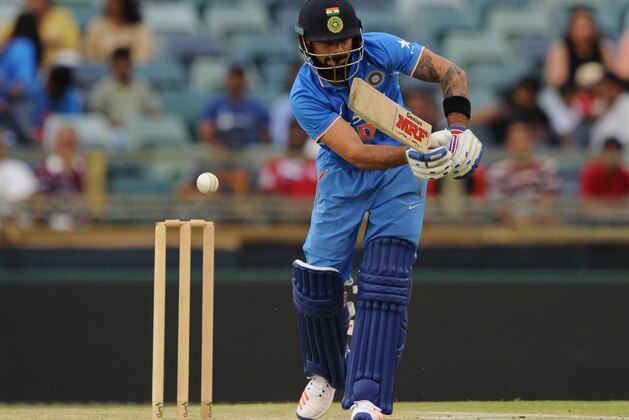 India's Virat Kohli plays a shot during the T20 cricket match between India and a Western Australian XI in Perth on January 8, 2016. AFP PHOTO / Greg WOOD
--IMAGE RESTRICTED TO EDITORIAL USE  NO COMMERCIAL USE-- / AFP / GREG WOOD        (Photo credit should read GREG WOOD/AFP/Getty Images)