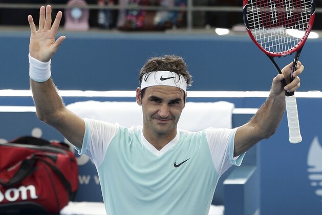 Roger Federer of Switzerland waves to the crowd after he won his semifinal match against Dominic Thiem of Austria during the Brisbane International tennis tournament in Brisbane, Australia, Saturday, Jan. 9, 2016. (AP Photo/Tertius Pickard)