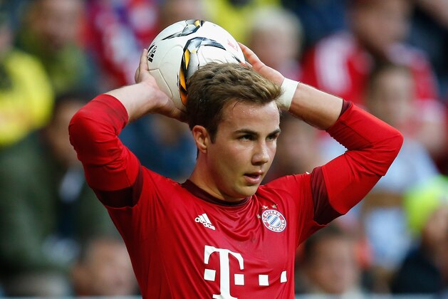 MUNICH, GERMANY - OCTOBER 04:  Mario Goetze of Bayern Muenchen takes a throw-in during the Bundesliga match between FC Bayern Muenchen and Borussia Dortmund at Allianz Arena on October 4, 2015 in Munich, Germany.  (Photo by Boris Streubel/Getty Images)