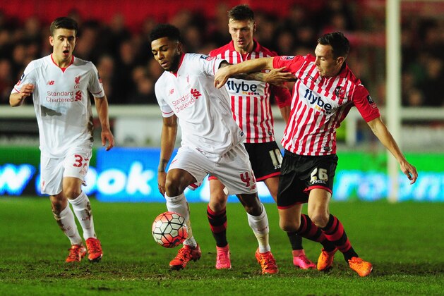 EXETER, ENGLAND - JANUARY 08:  Jerome Sinclair of Liverpool holds off Jordan Tillson of Exeter City during the Emirates FA Cup third round match between Exeter City and Liverpool at St James Park on January 8, 2016 in Exeter, England.  (Photo by Dan Mullan/Getty Images)