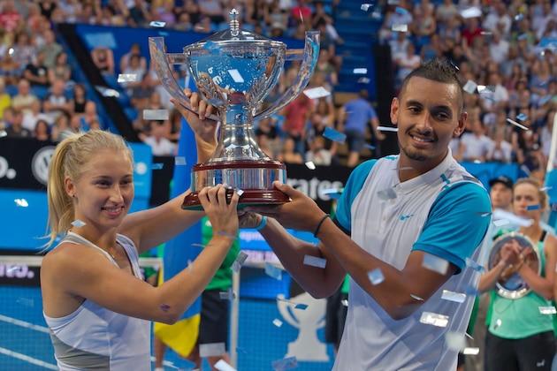 Nick Kyrgios and Daria Gavrilova of the Australia Green team celebrate with the Hopman Cup after defeating Alexandr Dolgopolov and Elina Svitolina of Ukraine during their mixed doubles final match on day seven of the Hopman Cup tennis tournament in Perth on January 9, 2016.     AFP PHOTO / Tony ASHBY  
-IMAGE RESTRICTED TO EDITORIAL USE - NO COMMERCIAL USE / AFP / TONY ASHBY        (Photo credit should read TONY ASHBY/AFP/Getty Images)