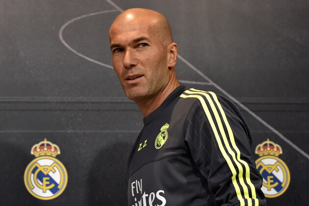 Real Madrid's new French coach Zinedine Zidane arrives to give a press conference at the Valdebebas training ground in Madrid on January 8, 2016.   AFP PHOTO / GERARD JULIEN / AFP / GERARD JULIEN        (Photo credit should read GERARD JULIEN/AFP/Getty Images)