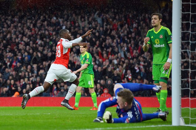 Arsenal's Costa Rican striker Joel Campbell (L) celebrates scoring their first goal during the English FA Cup third-round football match between Arsenal and Sunderland at the Emirates Stadium in London on January 9, 2016.   AFP PHOTO / GLYK KIRK

RESTRICTED TO EDITORIAL USE. No use with unauthorized audio, video, data, fixture lists, club/league logos or 'live' services. Online in-match use limited to 75 images, no video emulation. No use in betting, games or single club/league/player publications. / AFP / GLYN KIRK        (Photo credit should read GLYN KIRK/AFP/Getty Images)