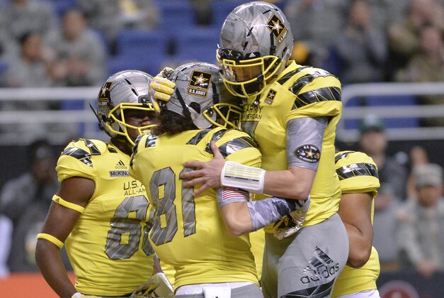 West wide receiver Simi Fehoko (81) celebrates a touchdown with West quarterback Shea Patterson during the first half of the Army All American Bowl high school football game against the East, Saturday, Jan. 9, 2016, in San Antonio. (AP Photo/Darren Abate)
