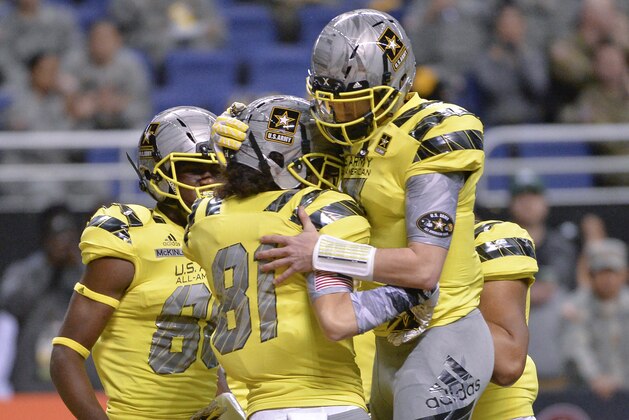 West wide receiver Simi Fehoko (81) celebrates a touchdown with West quarterback Shea Patterson during the first half of the Army All American Bowl high school football game against the East, Saturday, Jan. 9, 2016, in San Antonio. (AP Photo/Darren Abate)