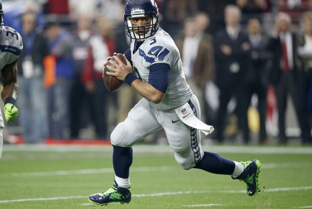 Seattle Seahawks quarterback Russell Wilson (3) scrambles against the Arizona Cardinals during the first half of an NFL football game, Sunday, Jan. 3, 2016, in Glendale, Ariz. (AP Photo/Ross D. Franklin)