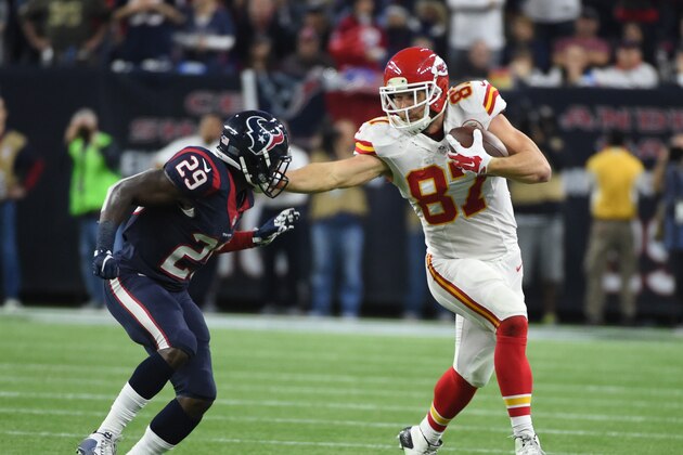 Kansas City Chiefs tight end Travis Kelce (87) tries to fend off Houston Texans free safety Andre Hal (29) during the second half of an NFL wild-card playoff football game Saturday, Jan. 9, 2016, in Houston. (AP Photo/Eric Christian Smith)