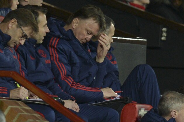 Manchester United's Dutch manager Louis van Gaal (C) sits in the dug-out during the English FA Cup third-round football match between Manchester United and Sheffield United at Old Trafford in north west England on January 9, 2016.   AFP PHOTO / OLI SCARFF

RESTRICTED TO EDITORIAL USE. No use with unauthorized audio, video, data, fixture lists, club/league logos or 'live' services. Online in-match use limited to 75 images, no video emulation. No use in betting, games or single club/league/player publications. / AFP / OLI SCARFF        (Photo credit should read OLI SCARFF/AFP/Getty Images)