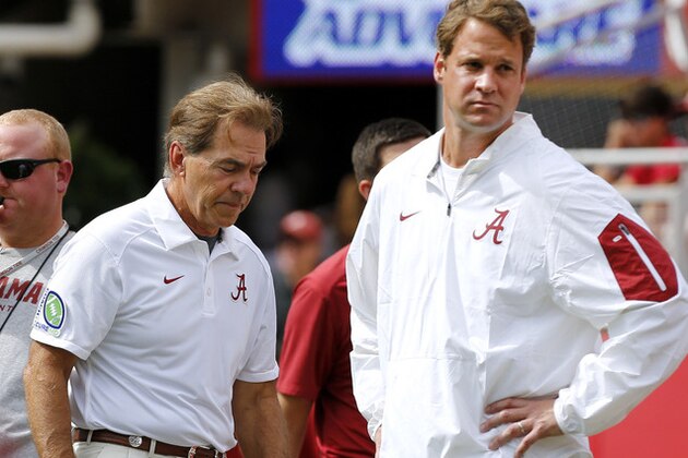 Alabama head coach Nick Saban, left, and offensive coordinator Lane Kiffin stand next to each other before an NCAA college football game against Louisiana Monroe in Tuscaloosa, Ala., Saturday, Sept. 26, 2015. (AP Photo/Jonathan Bachman)