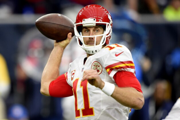 Jan 9, 2016; Houston, TX, USA; Kansas City Chiefs quarterback Alex Smith (11) throws a pass against the Houston Texans during the first quarter in a AFC Wild Card playoff football game at NRG Stadium. Mandatory Credit: John David Mercer-USA TODAY Sports