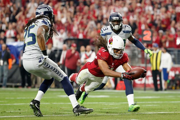 GLENDALE, AZ - JANUARY 03:  Wide receiver Larry Fitzgerald #11 of the Arizona Cardinals dives into the endzone to score a 17 yard touchdown in the second quarter of the NFL game against the Seattle Seahawks at the University of Phoenix Stadium on January 3, 2016 in Glendale, Arizona. The Seahawks defeated the Cardinals 36-6. (Photo by Christian Petersen/Getty Images)