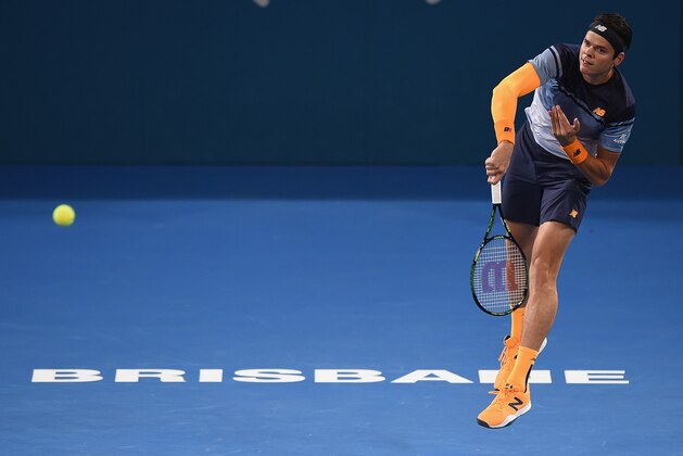 BRISBANE, AUSTRALIA - JANUARY 10: Milos Raonic of Canada serves in the Mens Final against Roger Federer of Switzerland  during day eight of the 2016 Brisbane International at Pat Rafter Arena on January 10, 2016 in Brisbane, Australia.  (Photo by Matt Roberts/Getty Images)