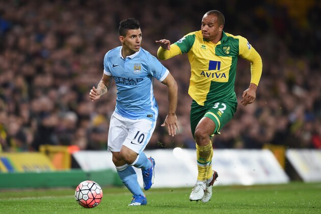 NORWICH, ENGLAND - JANUARY 09:  Sergio Aguero of Manchester City and Vadis Odjidja Ofoe of Norwich City compete for the ball during the Emirates FA Cup third round match between Norwich City and Manchester City at Carrow Road on January 9, 2016 in Norwich, England.  (Photo by Michael Regan/Getty Images)