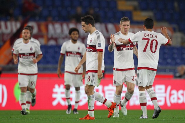 ROME, ITALY - JANUARY 09:  Jurai Kucka (L) of AC Milan celebrates with his team-mates after scoring their first goal during the Serie A match between AS Roma and AC Milan at Stadio Olimpico on January 9, 2016 in Rome, Italy.  (Photo by Paolo Bruno/Getty Images)