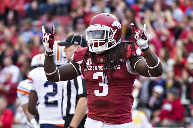 FAYETTEVILLE, AR - OCTOBER 31:  Alex Collins #3 of the Arkansas Razorbacks celebrates with teammates after scoring a touchdown against the UT Martin Skyhawks at Razorback Stadium on October 31, 2015 in Fayetteville, Arkansas.  The Razorbacks defeated the Skyhawks 63-28.  (Photo by Wesley Hitt/Getty Images)