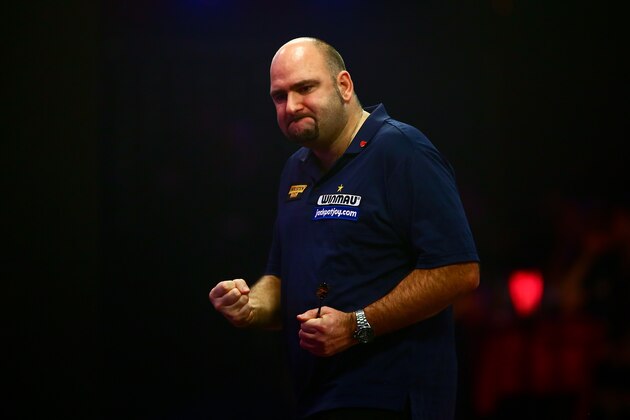 FRIMLEY, ENGLAND - JANUARY 10:  Scott Waites of England celebrates winning a set during his Men's final match against Jeff Smith of Canada during Day Nine of the BDO Lakeside World Professional Darts Championships at The Lakeside Country Club on January 10, 2016 in Frimley, England.  (Photo by Jordan Mansfield/Getty Images)