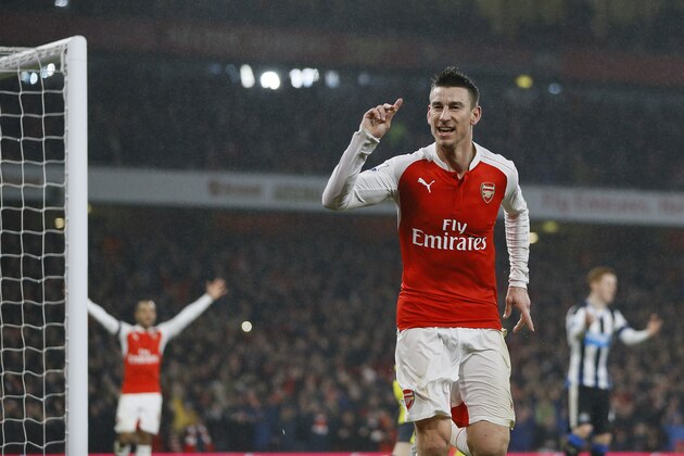 Arsenal's Laurent Koscielny celebrates scoring a goal during the English Premier League soccer match between Arsenal and Newcastle United at Emirates stadium in London, Saturday, Jan. 2, 2016. (AP Photo/Kirsty Wigglesworth)