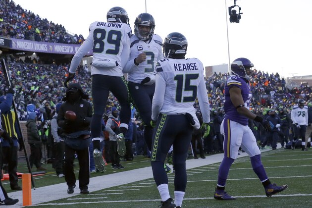 Seattle Seahawks wide receiver Doug Baldwin (89) and quarterback Russell Wilson (3) celebrate a touchdown as wide receiver Jermaine Kearse (15) joins during the second half of an NFL wild-card football game against the Minnesota Vikings, Sunday, Jan. 10, 2016, in Minneapolis. (AP Photo/Nam Y. Huh)