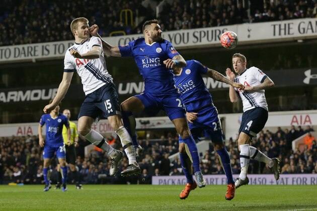Tottenham’s Eric Dier, left, competes for the ball with Leicester’s Marcin Wasilewski during the English FA Cup third round soccer match between Tottenham Hotspur and Leicester City at White Hart Lane in London, Sunday Jan. 10, 2016. (AP Photo/Tim Ireland)