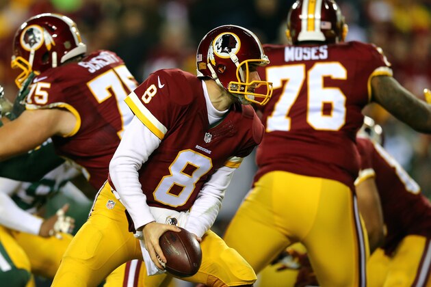 LANDOVER, MD - JANUARY 10: Quarterback Kirk Cousins #8 of the Washington Redskins looks to hand off the ball against the Green Bay Packers in the third quarter during the NFC Wild Card Playoff game at FedExField on January 10, 2016 in Landover, Maryland. (Photo by Elsa/Getty Images)