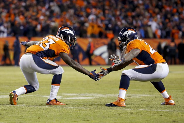 Denver Broncos running back Ronnie Hillman, left, celebrates after scoring with C.J. Anderson during the second half in an NFL football game against the San Diego Chargers, Sunday, Jan. 3, 2016, in Denver. (AP Photo/Jack Dempsey)