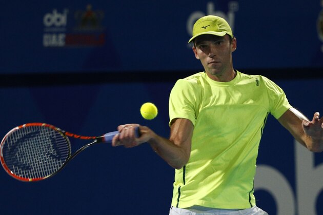 Croatia's Ivo Karlovic of Philippine Mavericks returns the ball to Australia's Bernard Tomic of Micromax Indian Aces during the men's singles match in their International Premier Tennis League (IPTL) on December 15, 2015 in the Emirate Dubai. AFP PHOTO / KARIM SAHIB / AFP / KARIM SAHIB        (Photo credit should read KARIM SAHIB/AFP/Getty Images)