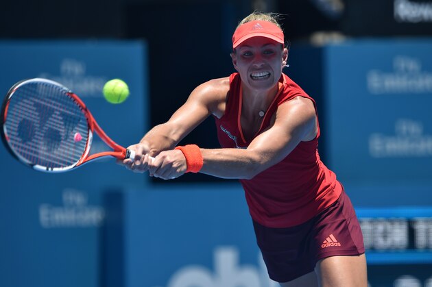 Angelique Kerber of Germany hits a return against Elina Svitolina of Ukraine during their women's singles first round match at the Sydney International tennis tournament in Sydney on January 11, 2016. AFP PHOTO / Peter PARKS --  IMAGE STRICTLY RESTRICTED TO EDITORIAL USE - STRICTLY NO COMMERCIAL USE / AFP / PETER PARKS        (Photo credit should read PETER PARKS/AFP/Getty Images)