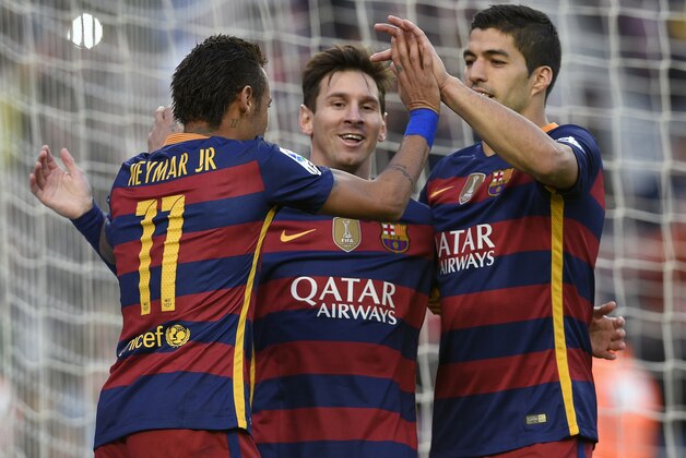 Barcelona's Argentinian forward Lionel Messi (C) celebrates a goal with teammates Barcelona's Brazilian forward Neymar (L) and Barcelona's Uruguayan forward Luis Suarez (R) during the Spanish league football match FC Barcelona vs Granada CF at the Camp Nou stadium in Barcelona on January 9, 2016.   AFP PHOTO / LLUIS GENE / AFP / LLUIS GENE        (Photo credit should read LLUIS GENE/AFP/Getty Images)