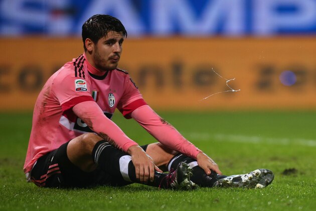 Juventus' Spanish forward Alvaro Morata spits during the Italian Serie A football match Sampdoria vs Juventus on January 10, 2016 at 'Luigi Ferraris Stadium' in Genoa. / AFP / MARCO BERTORELLO        (Photo credit should read MARCO BERTORELLO/AFP/Getty Images)