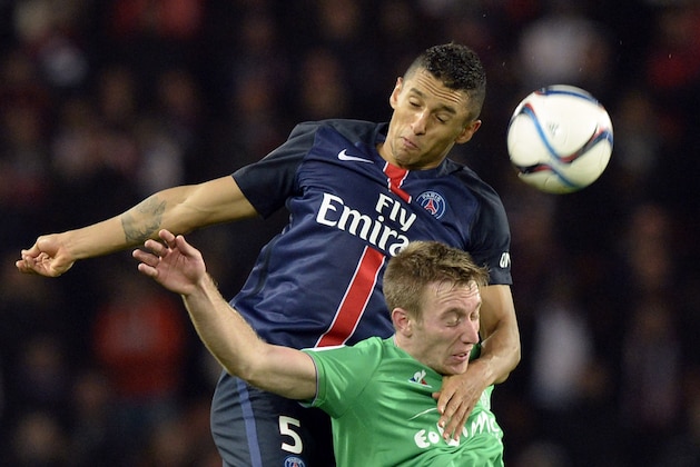 Paris Saint-Germain's Brazilian defender Marquinhos (back) heads the ball with Saint-Etienne's Slovenian forward Robert Beric during the French L1 football match between Paris Saint-Germain (PSG) and Saint-Etienne at the Parc des Princes stadium in Paris on October 25, 2015. AFP PHOTO / MIGUEL MEDINA        (Photo credit should read MIGUEL MEDINA/AFP/Getty Images)