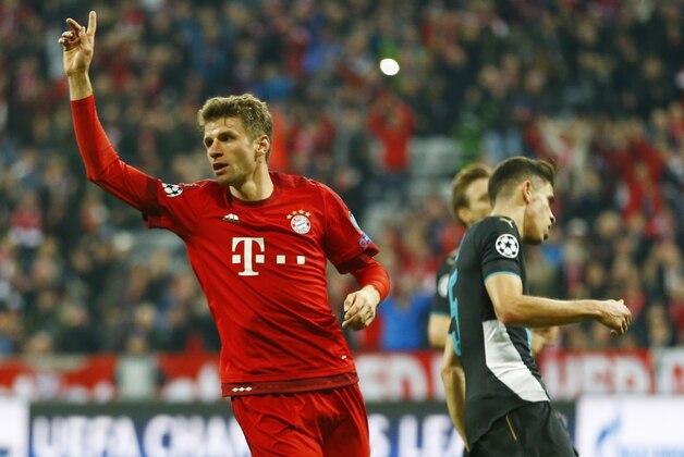 Bayern's Thomas Mueller celebrates after scoring his side's fifth goal during the Champions League Group F soccer match between Bayern Munich and Arsenal FC in Munich, southern Germany, Wednesday, Nov. 4, 2015. (AP Photo/Matthias Schrader)
