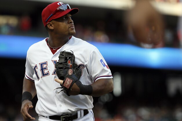 Texas Rangers third baseman Adrian Beltre (29) goes to the dugout at the bottom of the ninth inning in Game 4 of baseball's American League Division Series against the Toronto Blue Jays, Monday, Oct. 12, 2015, in Arlington, Texas. (AP Photo/Tony Gutierrez)