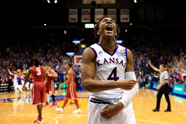 LAWRENCE, KS - JANUARY 04:  Devonte' Graham #4 of the Kansas Jayhawks celebrates as the Jayhawks defeat the Oklahoma Sooners 109-106 in triple overtime to win the game at Allen Fieldhouse on January 4, 2016 in Lawrence, Kansas.  (Photo by Jamie Squire/Getty Images)