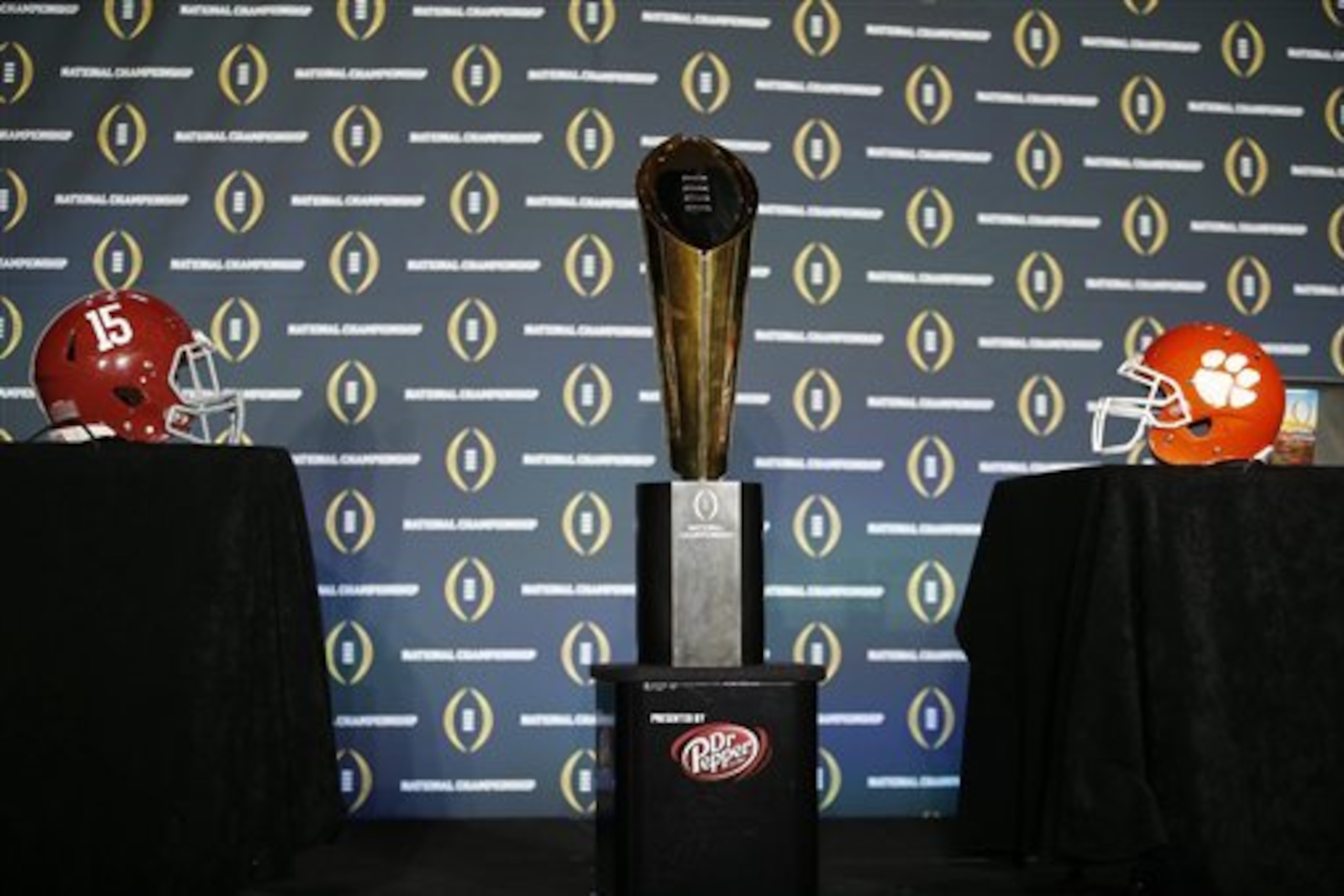 The national championship trophy is seen before a new conference for the NCAA college football playoff championship game between Clemson and Alabama Sunday, Jan. 10, 2016, in Glendale, Ariz. (AP Photo/David J. Phillip)