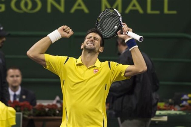 Novak Djokovic of Serbia celebrates winning the Qatar Open 2016 final match against Spain's Rafael Nadal, in Doha, Qatar, Saturday, Jan. 9, 2016. (AP Photo/Alexandra Panagiotidou)