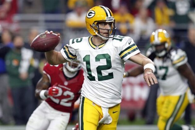 FILE - In this Sunday, Dec. 27, 2015, file photo, Green Bay Packers quarterback Aaron Rodgers (12) looks to throw against the Arizona Cardinals during the first half of an NFL football game in Glendale, Ariz. The offensive line is battered. The running game is inconsistent. Receivers aren't breaking out for enough big plays. It all adds up to subpar season for Rodgers, at least by the Packers' high standards.  (AP Photo/Rick Scuteri, File)