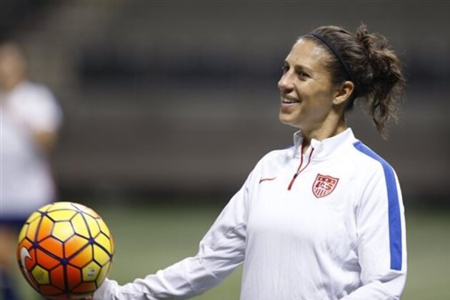 FILE - In this Dec. 15, 2015, file photo, U.S. midfielder Carli Lloyd smiles during a practice session for the team's international soccer friendly against China in New Orleans. Lloyd and defender Becky Sauerbrunn have been chosen captains of the U.S. Women's National Team.  (AP Photo/Gerald Herbert, File)