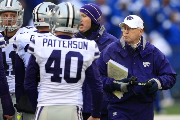 Kansas State head coach Bill Snyder, right, stands with his team during a timeout in the first half of an NCAA college football game against Kansas in Lawrence, Kan., Saturday, Nov. 28, 2015. (AP Photo/Orlin Wagner)
