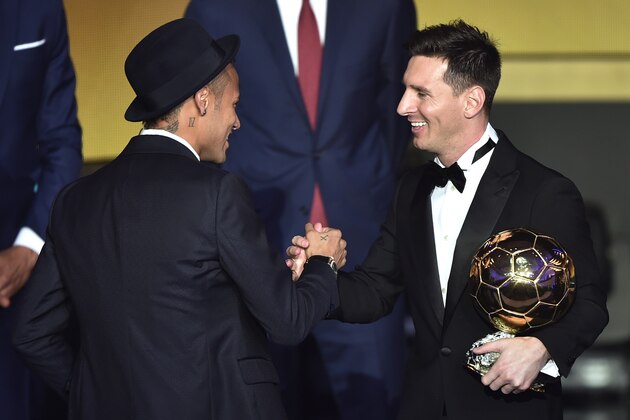 FC Barcelona and Argentina's forward Lionel Messi (R) holds his trophy as he shakes hands with FC Barcelona and Brazils forward  Neymar after receiving the 2015 FIFA Ballon dOr award for player of the year during the 2015 FIFA Ballon d'Or award ceremony at the Kongresshaus in Zurich on January 11, 2016. AFP PHOTO / FABRICE COFFRINI / AFP / FABRICE COFFRINI        (Photo credit should read FABRICE COFFRINI/AFP/Getty Images)