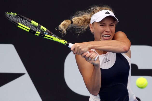 Denmark's Caroline Wozniacki hits a return against Sloane Stephens of the US during their women's singles semi-final match at the WTA Auckland Classic tennis tournament in Auckland on January 9, 2016. AFP PHOTO / Michael Bradley / AFP / MICHAEL BRADLEY        (Photo credit should read MICHAEL BRADLEY/AFP/Getty Images)