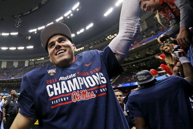 Mississippi quarterback Chad Kelly (10) reacts with fans after their victory over Oklahoma State in the Sugar Bowl college football game in New Orleans, Friday, Jan. 1, 2016. Mississippi won 48-20. (AP Photo/Jonathan Bachman)