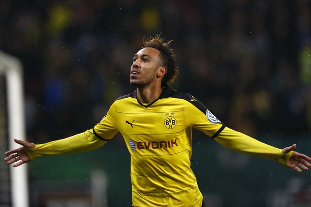 Dortmund's Pierre-Emerick Aubameyang celebrates after scoring his side's opening goal during the German soccer cup (DFB Pokal) match between FC Augsburg and Borussia Dortmund at the WWK Arena stadium in Augsburg, Germany, Wednesday, Dec. 16, 2015. (AP Photo/Matthias Schrader)
