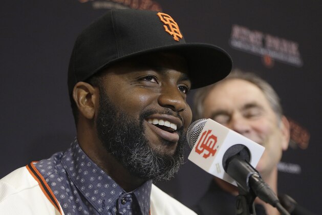 San Francisco Giants outfielder Denard Span, left, speaks next to manager Bruce Bochy at a news conference in San Francisco, Friday, Jan. 8, 2016. The Giants agreed on a $31 million, three-year deal with free agent Span, giving them the outfielder and leadoff hitter they had sought. (AP Photo/Jeff Chiu)