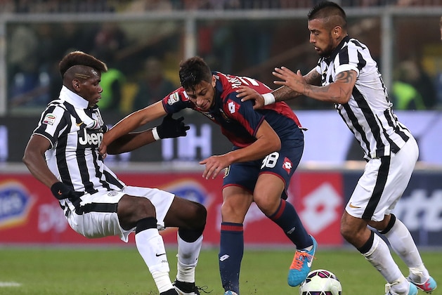 Juventus' French midfielder Labile Paul Pogba (L) fights for the ball with Genoa's midfielder Rolando Mandragora and Juventus' Chilean midfielder Arturo Pardo Vidal during the Italian Serie A football match Genoa Vs Juventus on October 29, 2014 at Luigi Ferraris Stadium in Genoa. AFP PHOTO / MARCO BERTORELLO (Photo credit should read MARCO BERTORELLO/AFP/Getty Images) Juventus' French midfielder Labile Paul Pogba (L) fights for the ball with Genoa's midfielder Rolando Mandragora and Juventus' Chilean midfielder Arturo Pardo Vidal during the Italian Serie A football match Genoa Vs Juventus on October 29, 2014 at Luigi Ferraris Stadium in Genoa. AFP PHOTO / MARCO BERTORELLO (Photo credit should read MARCO BERTORELLO/AFP/Getty Images)