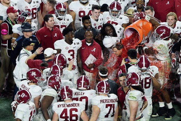 GLENDALE, AZ - JANUARY 11:  Head coach Nick Saban of the Alabama Crimson Tide gets dunked with Gatorade by the team after defeating the Clemson Tigers with a score of 45 to 40 in the 2016 College Football Playoff National Championship Game at University of Phoenix Stadium on January 11, 2016 in Glendale, Arizona.  (Photo by Norm Hall/Getty Images)
