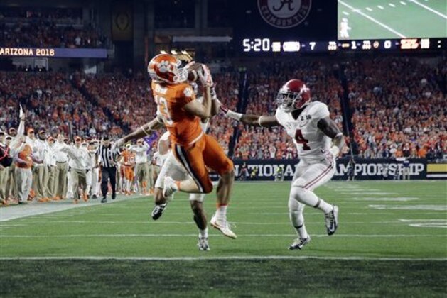 Clemson's Hunter Renfrow catches a touchdown pass in front of Alabama's Minkah Fitzpatrick and Eddie Jackson during the first half of the NCAA college football playoff championship game Monday, Jan. 11, 2016, in Glendale, Ariz. (AP Photo/David J. Phillip) Clemson's Hunter Renfrow catches a touchdown pass in front of Alabama's Minkah Fitzpatrick and Eddie Jackson during the first half of the NCAA college football playoff championship game Monday, Jan. 11, 2016, in Glendale, Ariz. (AP Photo/David J. Phillip)