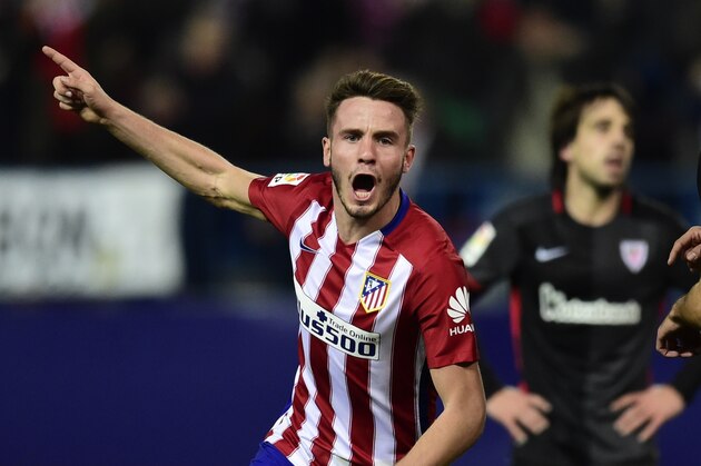 Atletico Madrid's midfielder Saul Niguez celebrates after scoring a goal during the Spanish league football match Club Atletico de Madrid vs Athletic Club Bilbao at the Vicente Calderon stadium in Madrid on December 13, 2015.   AFP PHOTO / JAVIER SORIANO / AFP / JAVIER SORIANO        (Photo credit should read JAVIER SORIANO/AFP/Getty Images)